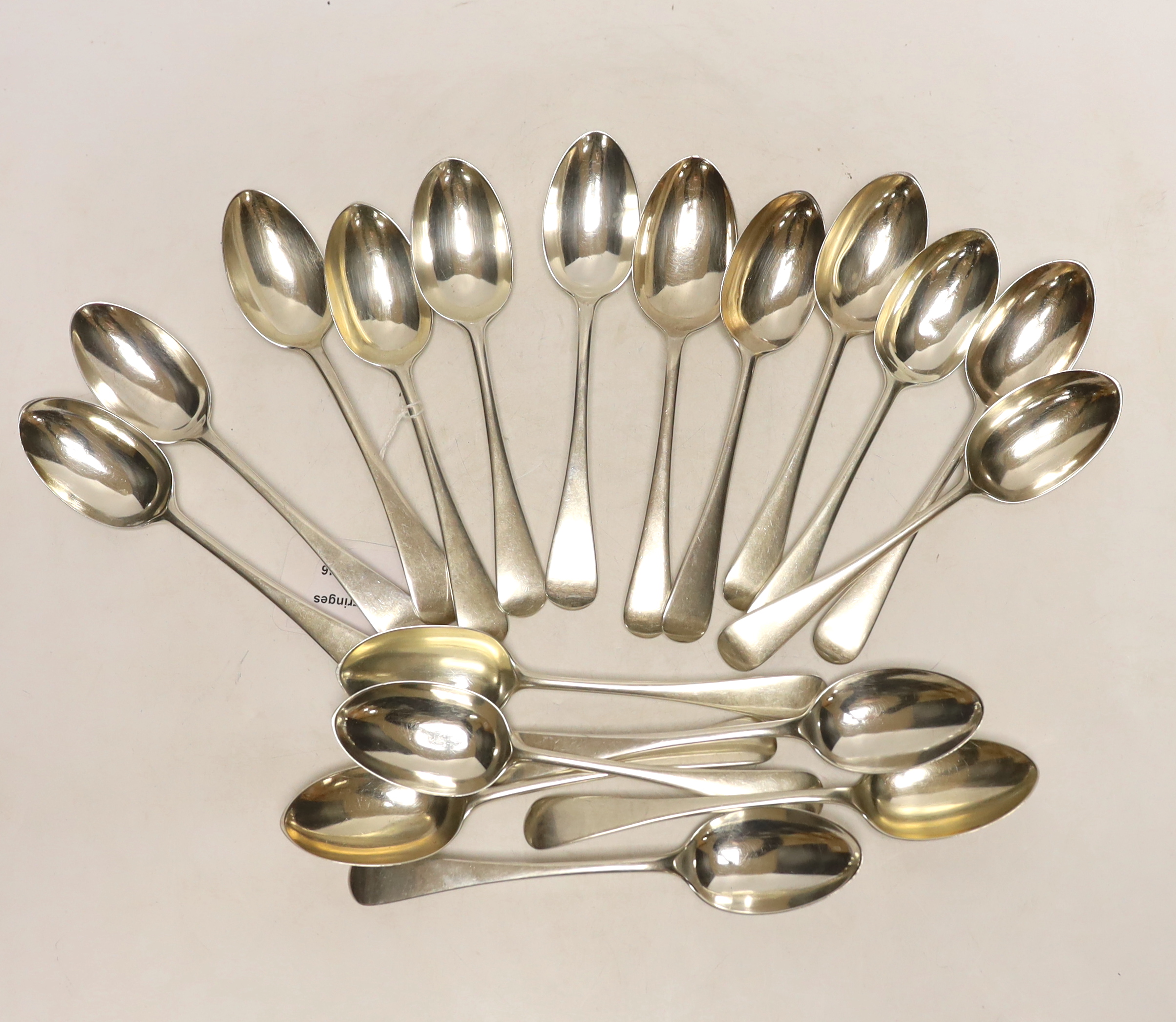 Eleven Gorge V silver Old English pattern dessert spoons, Goldsmiths & Silversmiths Co Ltd, London, 1930 and seven other silver dessert spoons, 29oz.